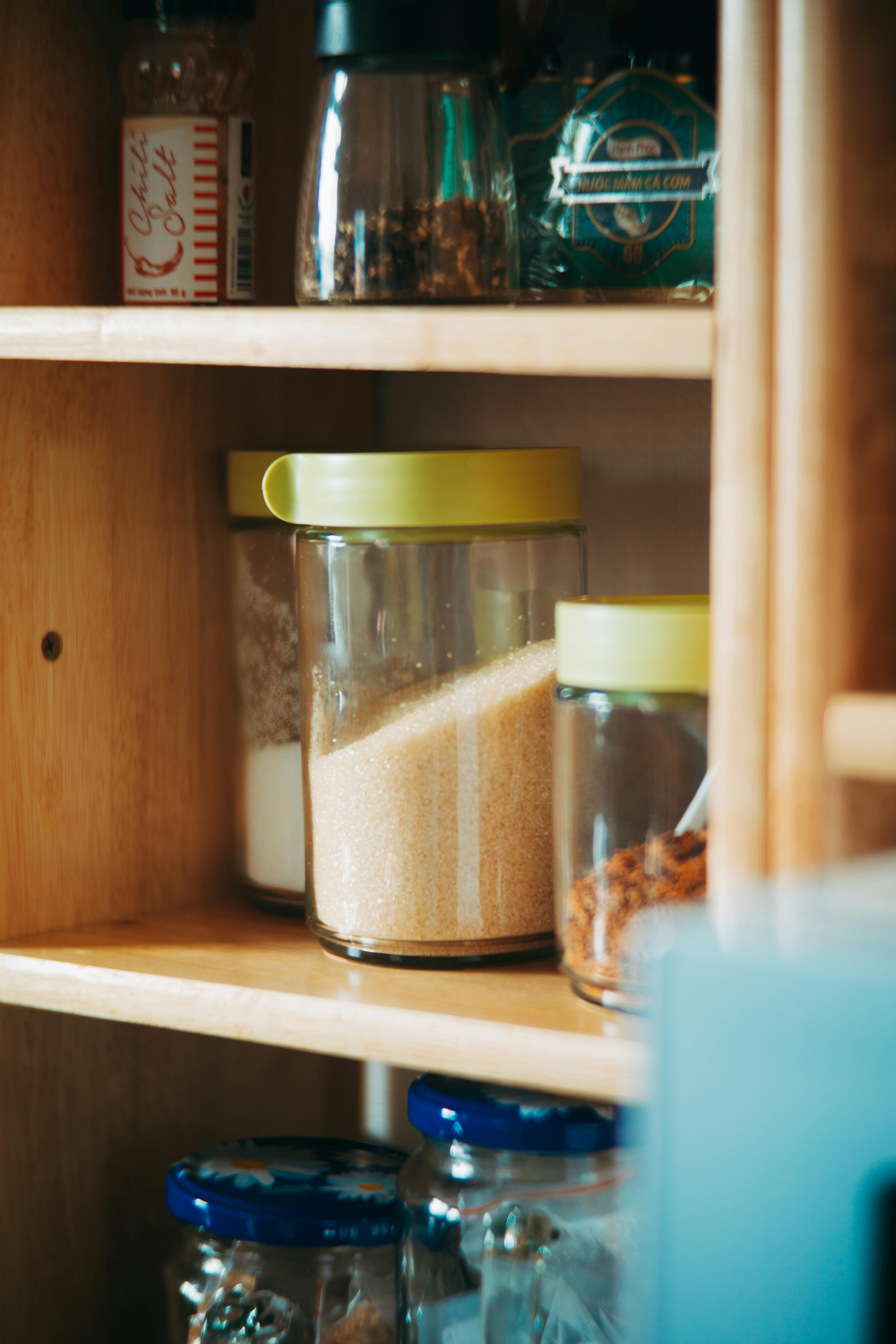 Beautifully organized kitchen pantry with labeled jars and containers